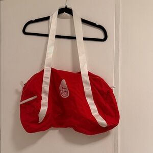 Vibrant Red Travel Bag with White Straps